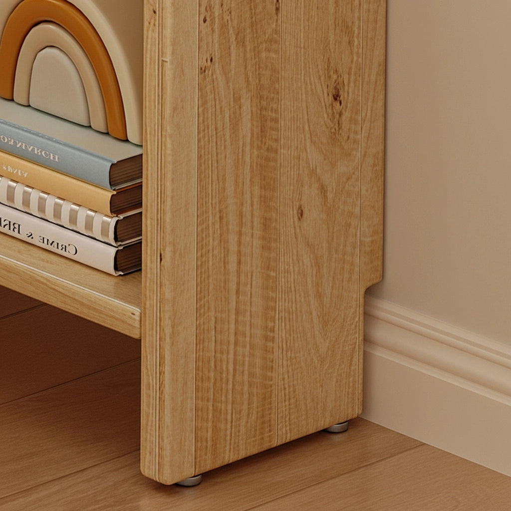 Detailed close-up view of the natural wood grain and bottom panel corner on the solid pine bookshelf