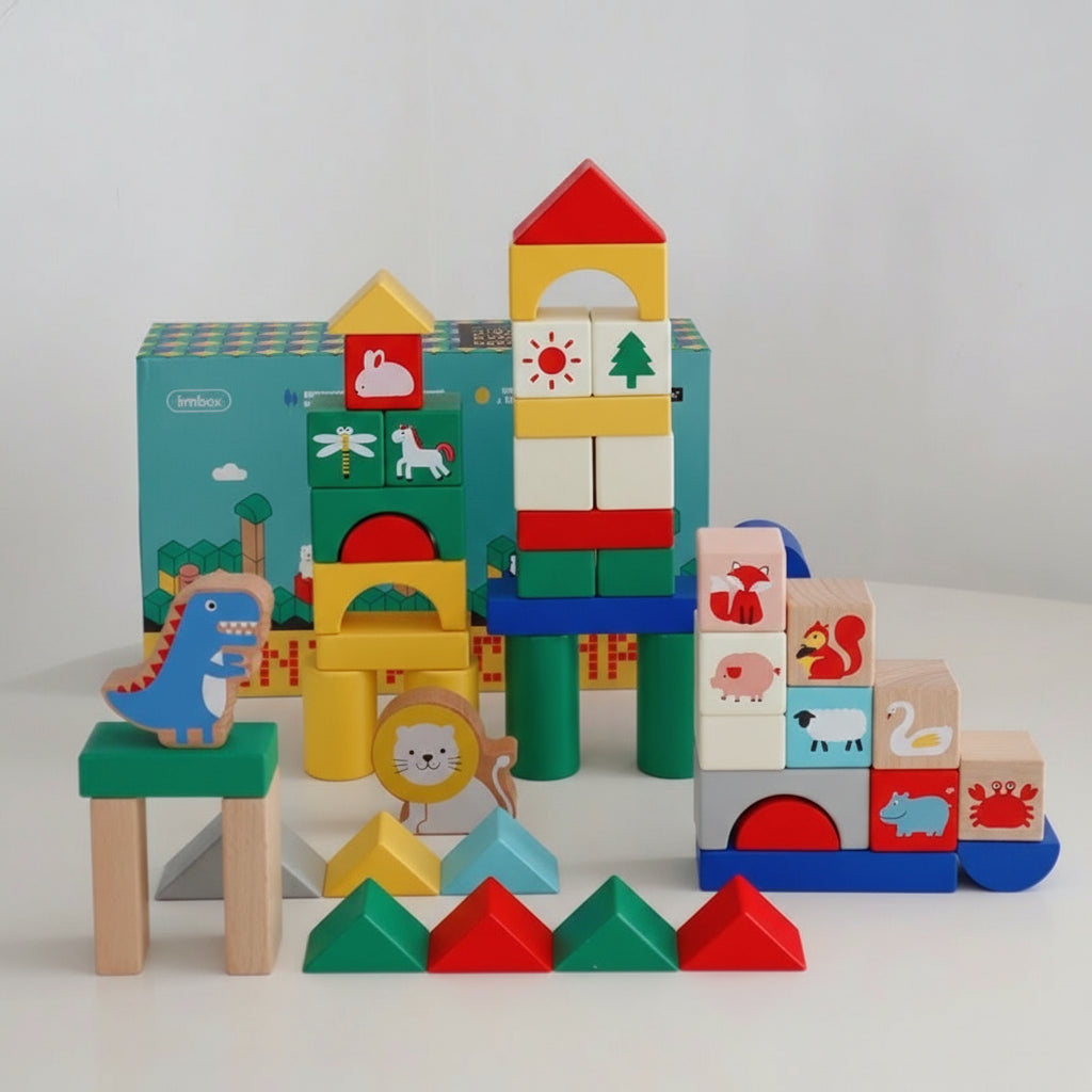 Symmetrically built toy structures from the building blocks set displayed with the packaging box behind