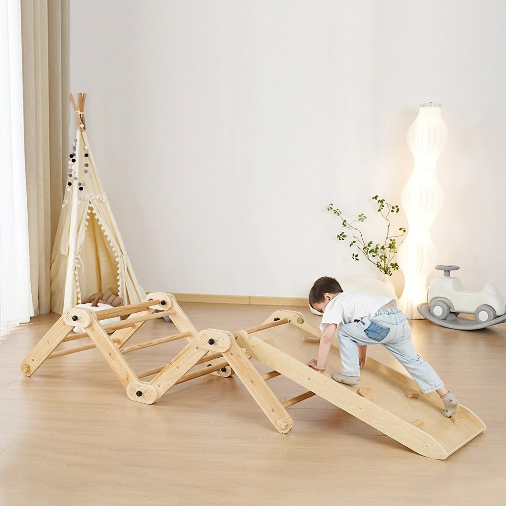 Toddler crawling on an extended zig-zag bridge configuration of the wooden climbing set with a ramp