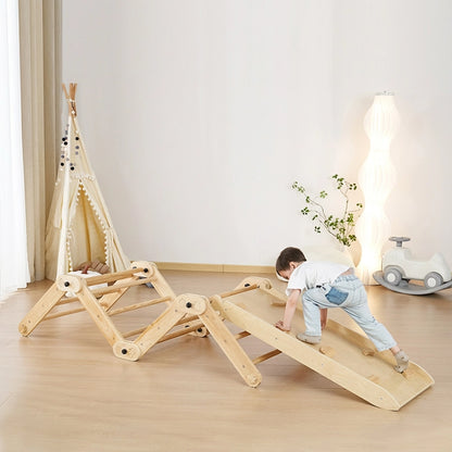 Toddler crawling on an extended zig-zag bridge configuration of the wooden climbing set with a ramp