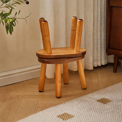 Two solid rubber wood low stools stacked together with one placed upside down on top of the other