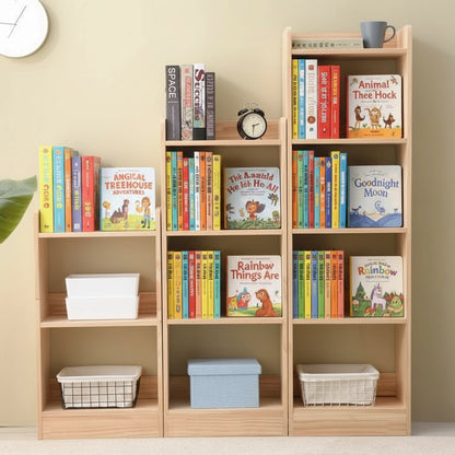 Front view of three vertical kids bookcases in an ascending stepped arrangement holding colorful children's books